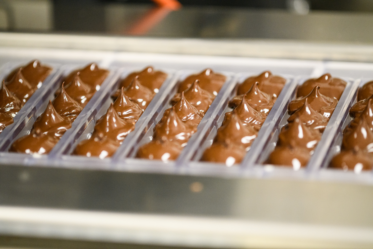 Nove Luxury Cannabis Chocolates in production; sourcing sustainable chocolate is essential to our social promise.
